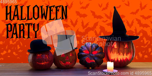 Image of Scary pumpkins on orange background, the night of fear