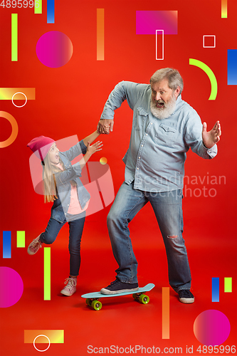 Image of Senior man, grandfather having fun and spending time together with girl, granddaughter. Joyful elderly lifestyle concept