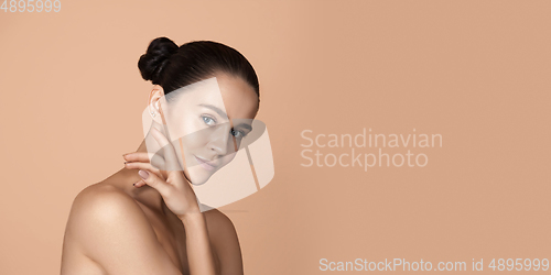 Image of Beautiful face of young woman with clean fresh skin. Flyer with copyspace