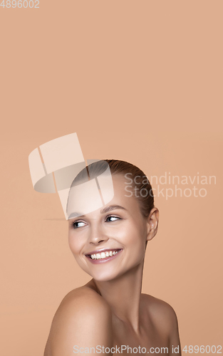 Image of Beautiful face of young woman with clean fresh skin. Flyer with copyspace