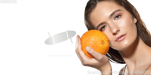 Image of Beautiful face of young woman with clean fresh skin. Flyer with copyspace