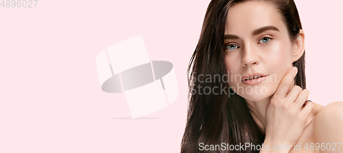 Image of Beautiful face of young woman with clean fresh skin. Flyer with copyspace