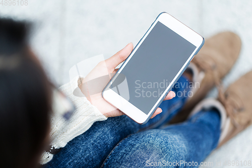 Image of Woman use of mobile phone