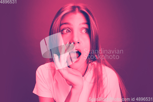 Image of Close up portrait of caucasian woman isolated on studio background. Modern and trendy duotone effect