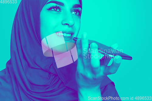 Image of Close up portrait of woman isolated on studio background. Modern and trendy duotone effect