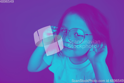 Image of Close up portrait of caucasian girl isolated on studio background. Modern and trendy duotone effect