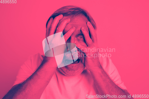Image of Close up portrait of caucasian man isolated on studio background. Modern and trendy duotone effect