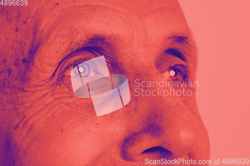 Image of Close up portrait of caucasian man isolated on studio background. Modern and trendy duotone effect