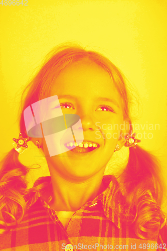 Image of Close up portrait of caucasian girl isolated on studio background. Modern and trendy duotone effect