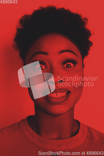 Image of Close up portrait of african woman isolated on studio background. Modern and trendy duotone effect