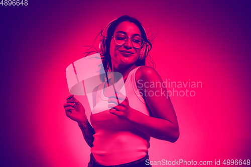 Image of Close up portrait of caucasian woman isolated on studio background. Modern and trendy duotone effect