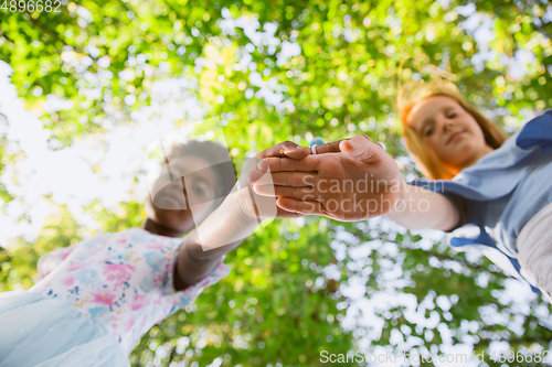 Image of Interracial kids, friends, girls playing together at the park in summer day