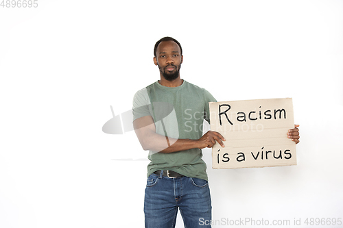 Image of Young man protesting isolated on white studio background. Activism, active social position, protest, actual problems.