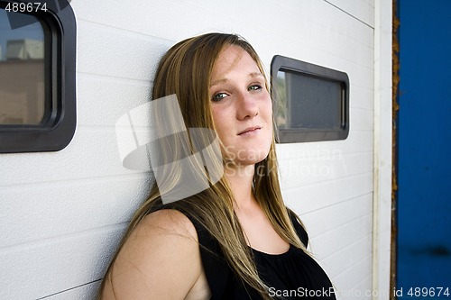 Image of Urban Girl in a Black Dress Looking At the Camera