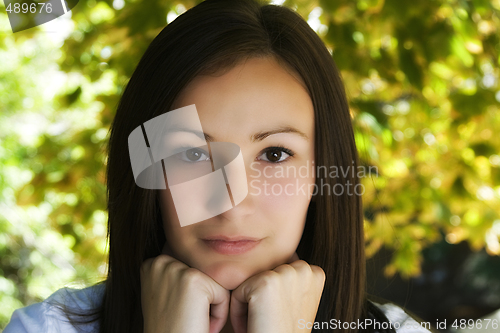 Image of Beautiful Teenager with Leaves in the Background