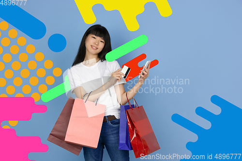 Image of Asian woman\'s portrait isolated on bright, modern illustrated background.