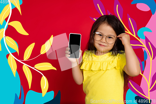 Image of Asian little girl portrait isolated on bright, modern illustrated background.