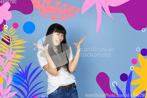 Image of Asian woman\'s portrait isolated on bright, modern illustrated background.