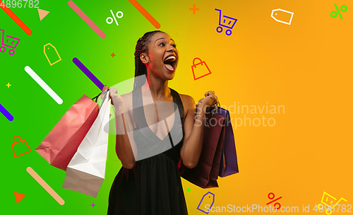 Image of African-american woman portrait isolated on bright, modern illustrated background.