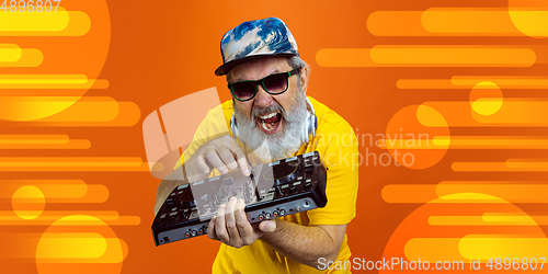 Image of Senior hipster man using devices, gadgets. Tech and joyful elderly lifestyle concept. Bright illustrated background