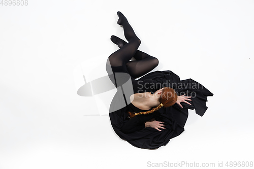 Image of Young and graceful ballet dancer in minimal black style isolated on white studio background