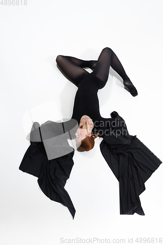 Image of Young and graceful ballet dancer in minimal black style isolated on white studio background