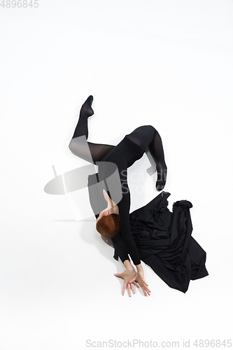 Image of Young and graceful ballet dancer in minimal black style isolated on white studio background