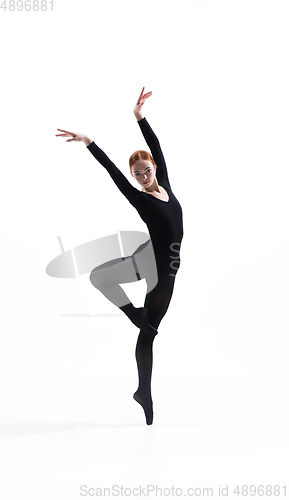 Image of Young and graceful ballet dancer in minimal black style isolated on white studio background