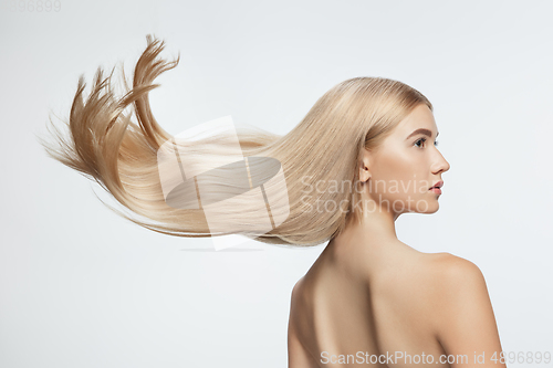 Image of Beautiful model with long smooth, flying blonde hair