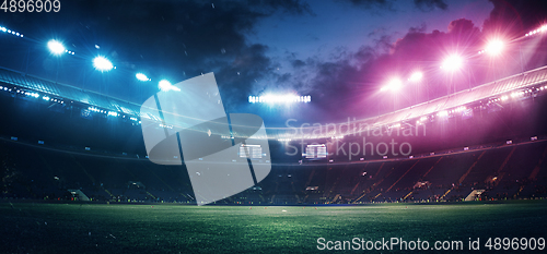 Image of Full stadium and neoned colorful flashlights background