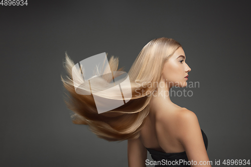 Image of Beautiful model with long smooth, flying blonde hair