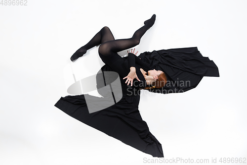 Image of Young and graceful ballet dancer in minimal black style isolated on white studio background