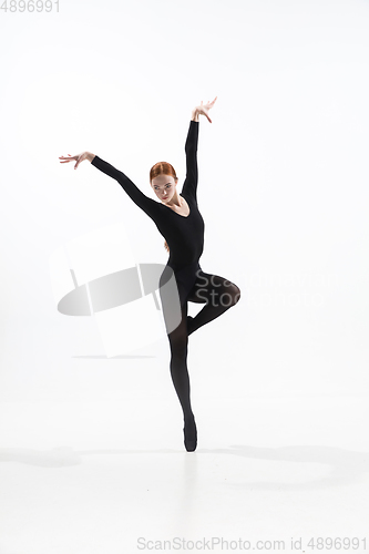 Image of Young and graceful ballet dancer in minimal black style isolated on white studio background