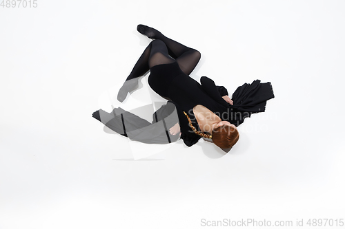 Image of Young and graceful ballet dancer in minimal black style isolated on white studio background