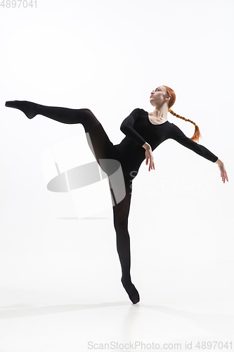 Image of Young and graceful ballet dancer in minimal black style isolated on white studio background