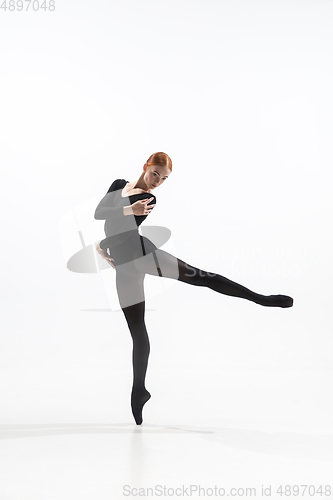 Image of Young and graceful ballet dancer in minimal black style isolated on white studio background