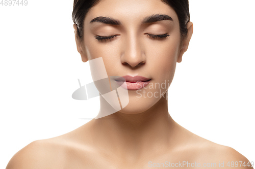 Image of Portrait of beautiful jewish woman isolated on white studio background. Beauty, fashion, skincare, cosmetics concept.