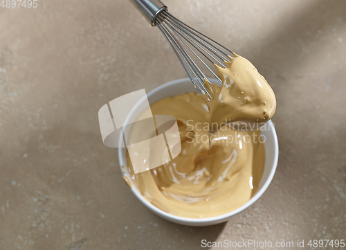 Image of bowl of whipped instant coffee with sugar and water