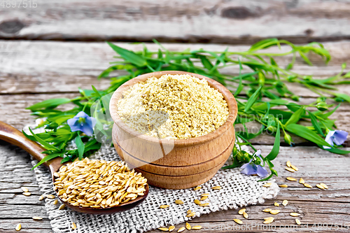 Image of Bran flaxseed in bowl on grey boar