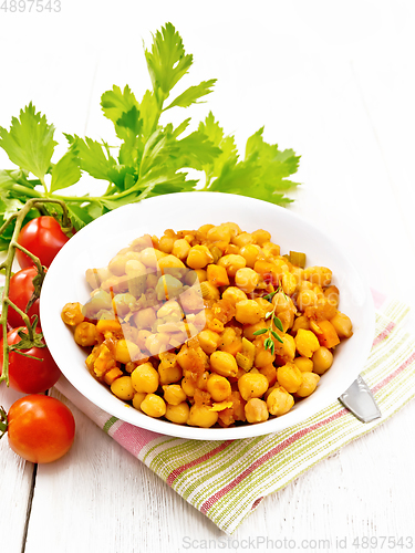 Image of Chickpeas with vegetables stewed in plate on white board