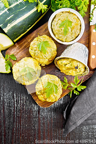 Image of Cupcake with cheese and zucchini on dark board top