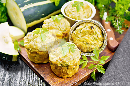 Image of Cupcake with cheese and zucchini on dark board