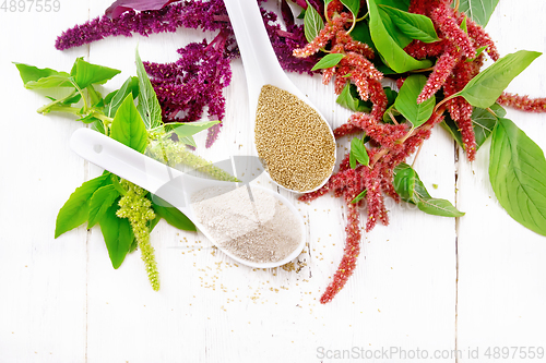 Image of Flour and seeds amaranth in spoons on light board top