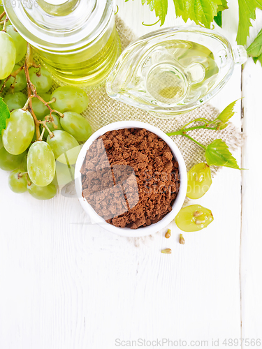 Image of Flour grape seed in bowl on light board top