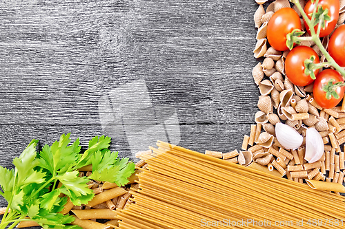 Image of Frame different whole grain and rye pasta on black board