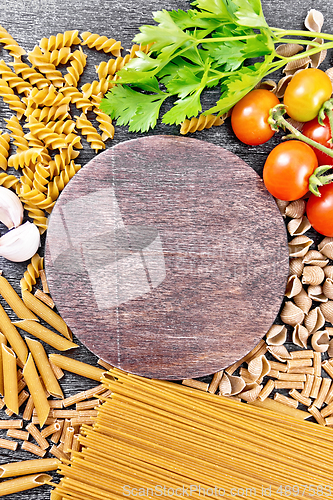 Image of Frame different whole grain and rye pasta on board