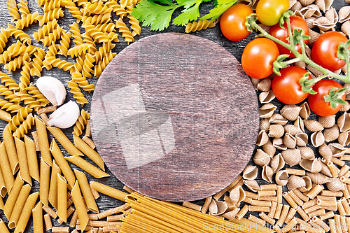 Image of Frame different whole grain and rye pasta on dark board