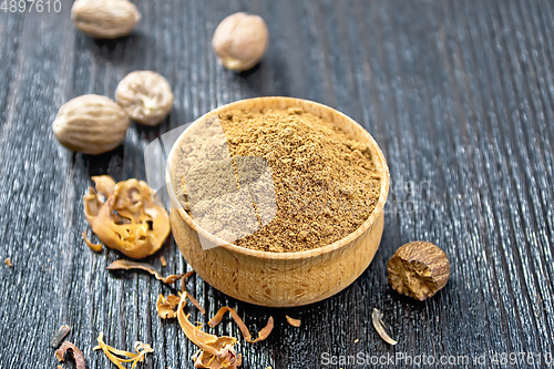 Image of Nutmeg ground in bowl on wooden table