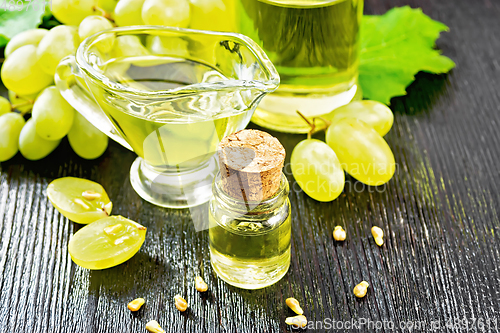 Image of Oil grape in vial on table