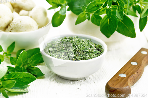 Image of Oregano dried in bowl on board